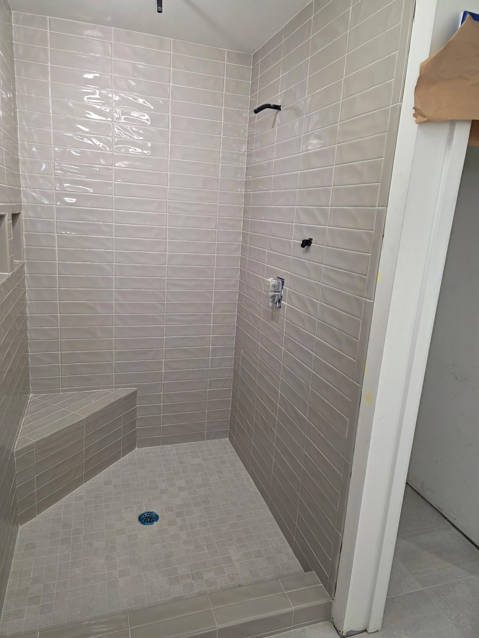 White marble shower with bench seat