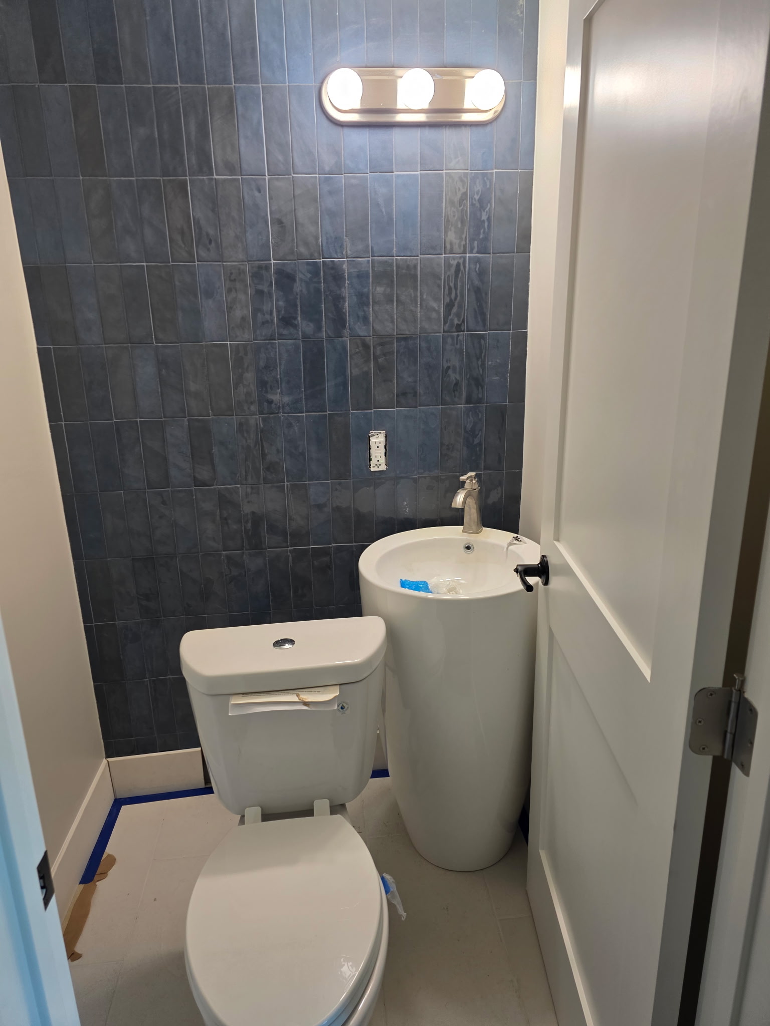 Marble shower with penny mosaic floor